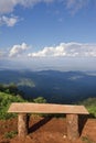 Lonely chair with grass, mountain and cloudy sky view of Chiangmai Thailand Royalty Free Stock Photo