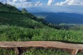 Lonely chair with grass, mountain and cloudy sky view of Chiangmai Thailand Royalty Free Stock Photo