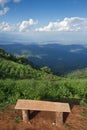 Lonely chair with grass, mountain and cloudy sky view of Chiangmai Thailand Royalty Free Stock Photo