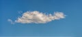 Lonely cloud in blue sky, panorama format