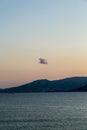 Lonely cloud over an island mountain, sunset Royalty Free Stock Photo