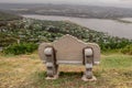 Lonely concrete bench overlooking river near Knysna, South Africa Royalty Free Stock Photo