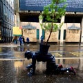 Lonely Cop26 demonstrator crawling in rain