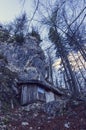 A lonely cottage in the misty and foggy forest just after the storm. Photograph was taken at Corvara in Dolomites mountain range, Royalty Free Stock Photo