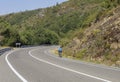 A lonely cyclist biking in an empty spanish road during the summer, Triacastela, Galicia, Spain.