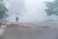 Lonely cyclist in the fog