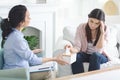 Lonely sad young lady crying at psychotherapist session Royalty Free Stock Photo