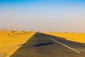 Lonely Desert Road in Dubai United Arab Emirates. Road covered by sand. Royalty Free Stock Photo