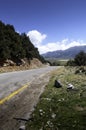 A lonely deserted road leads through the mountains or highlands on the Greek island of Crete. The road loses itself on the horizon Royalty Free Stock Photo