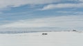 Lonely desolate log cabins at Canada's Ivvavik NP coast in winter