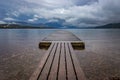 Lonely dock at Lake McDonald, Glacier National Park Royalty Free Stock Photo