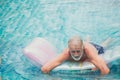 Lonely elder, Old man playing at pool alone at nursing home Royalty Free Stock Photo