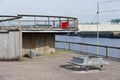 Lonely empty bench at the River Clyde in Govan for mindfulness and meditation Royalty Free Stock Photo