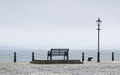 Lonely empty bench seat coastal sea peaceful quiet mindfulness scene view Royalty Free Stock Photo