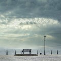 Lonely empty bench seat coastal sea storm but peaceful quiet mindfulness scene view