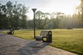Lonely empty bench in summer city park Royalty Free Stock Photo