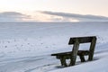 Lonely and empty bench - winter landscape Royalty Free Stock Photo