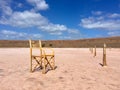 Lonely empty chair in the deserted area under the open sk, take a seat and enjoy the view Royalty Free Stock Photo