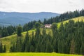 Lonely farmhouse on a green hill Royalty Free Stock Photo