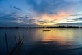 Lonely fisherman in canoe on Sepik river in Papua New Guinea during dusk Royalty Free Stock Photo