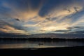 Lonely fisherman in canoe on Sepik river in Papua New Guinea during dusk Royalty Free Stock Photo