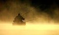 Lonely fisherman. Foggy autumn morning in Lithuania Royalty Free Stock Photo