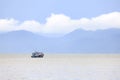 Lonely fishing boat in a sea Royalty Free Stock Photo