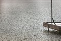 Lonely fishing pier on a lake under heavy shower rain. Bad weather. Bad mood concept Royalty Free Stock Photo