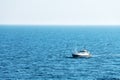 Lonely fishing ship trawler boat on ocean