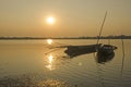 Floating two boats in the water under evening sunlight Royalty Free Stock Photo