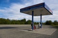 Lonely gas station with only two pumps on the Richardson Highway in Alaska at the end of a sunny day in summer. Royalty Free Stock Photo