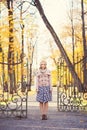 Lonely girl being sad alone in the park in the autumn Royalty Free Stock Photo