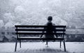 Lonely girl on a bench by the lake Royalty Free Stock Photo