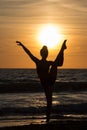 Lonely Dancer ballet posing on the beach sunset silhouette sea Royalty Free Stock Photo