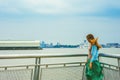 Young woman thinking outdoors by river in New York City