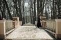 Lonely girl on the old bridge Royalty Free Stock Photo