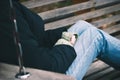 Lonely girl sitting on a bench in autumn park Royalty Free Stock Photo