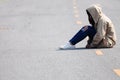 Lonely Girl Sitting on the Road Royalty Free Stock Photo