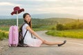 Lonely girl sitting on the road Royalty Free Stock Photo