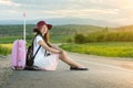 Lonely girl sitting on the road Royalty Free Stock Photo