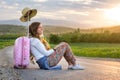 Lonely girl sitting on the road Royalty Free Stock Photo