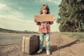 Lonely girl with suitcase Royalty Free Stock Photo