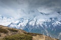 Lonely grazing horse on the background of snowy mountains, Nepal Royalty Free Stock Photo