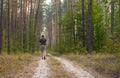 Lonely hiker on an earth road