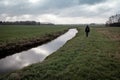 Lonely hiker in a wintry Dutch landscape