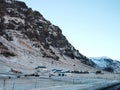 A lonely house at the foot of the mountains in Iceland. Incredible landscapes of nature. Life for a social phobia