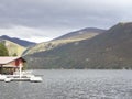 a lonely house at the lake in the mountains Royalty Free Stock Photo