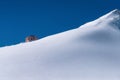 A lonely house on top of a mountain. Mount Cheget. Royalty Free Stock Photo