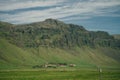 Lonely icelandic house by the mountain in iceland. Natural Iceland travel landscape. Royalty Free Stock Photo