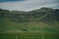 Lonely icelandic house by the mountain in iceland. Natural Iceland travel landscape. Royalty Free Stock Photo